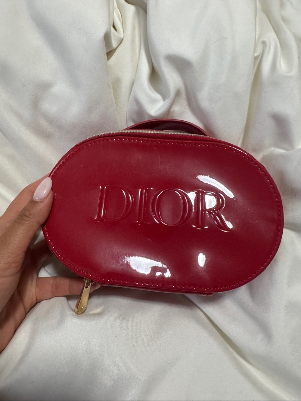 Dior glossy red cosmetic bag